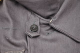 Hidden catch and button for wear of the tunic with closed collar